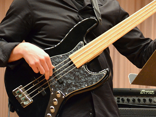 A bass guitarist performing on stage
