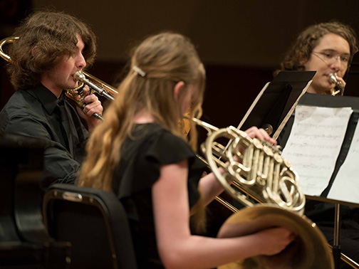 Young brass students play in small ensemble